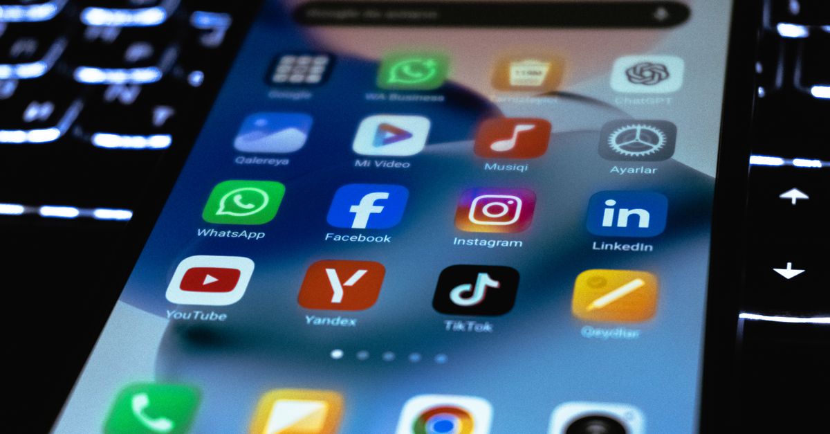 Close-up of a smartphone screen showing popular social media and utility app icons.